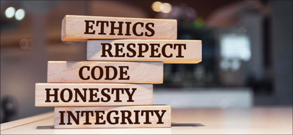wooden building blocks labelled Ethics Respect Code Honesty Integrity